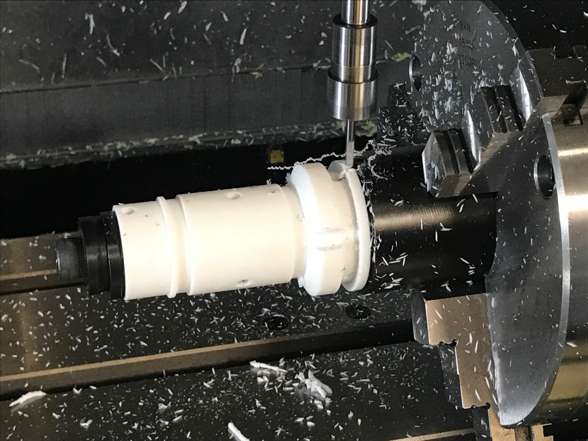 CNC lathe machining a precision plastic component