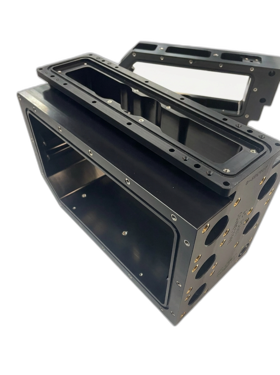 Precision CNC-machined black plastic enclosure with stainless steel threaded inserts