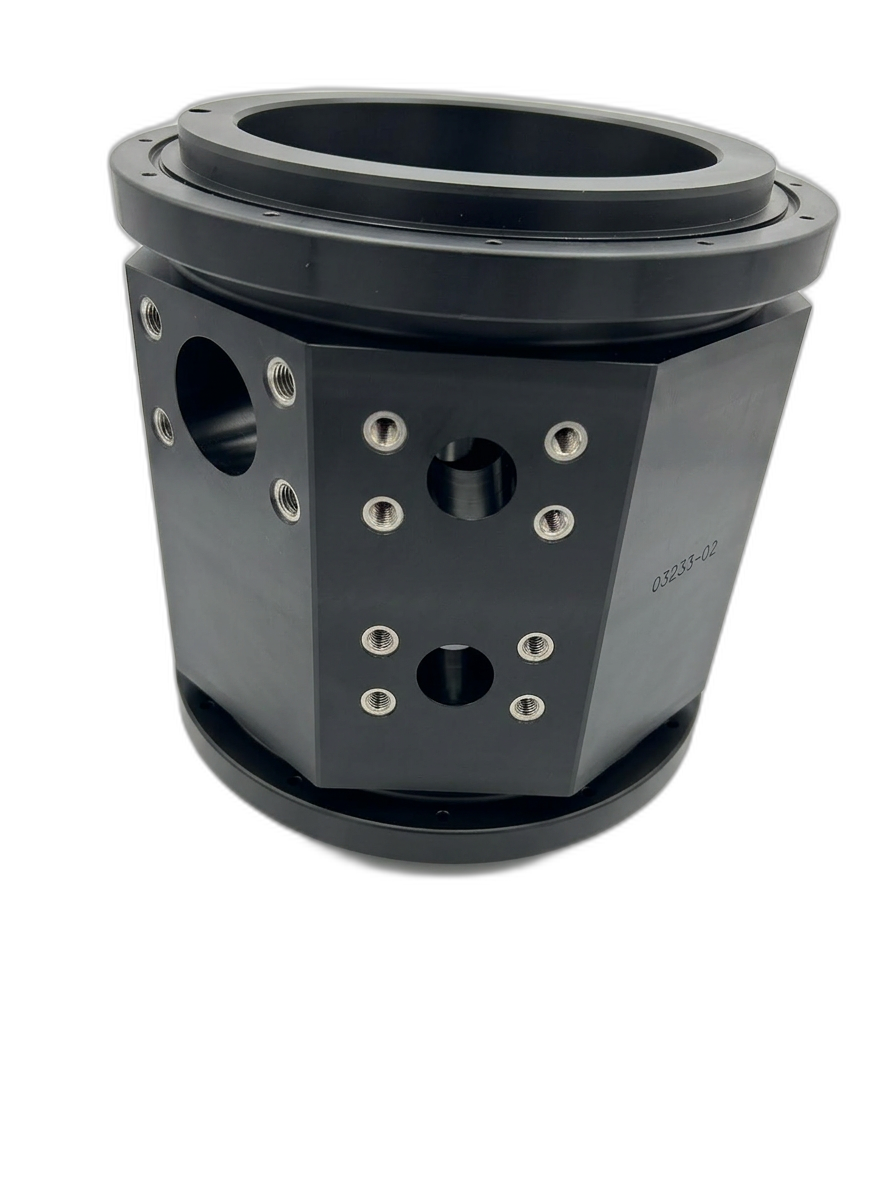 Large black machined plastic octagonal housing with flange and stainless threaded inserts